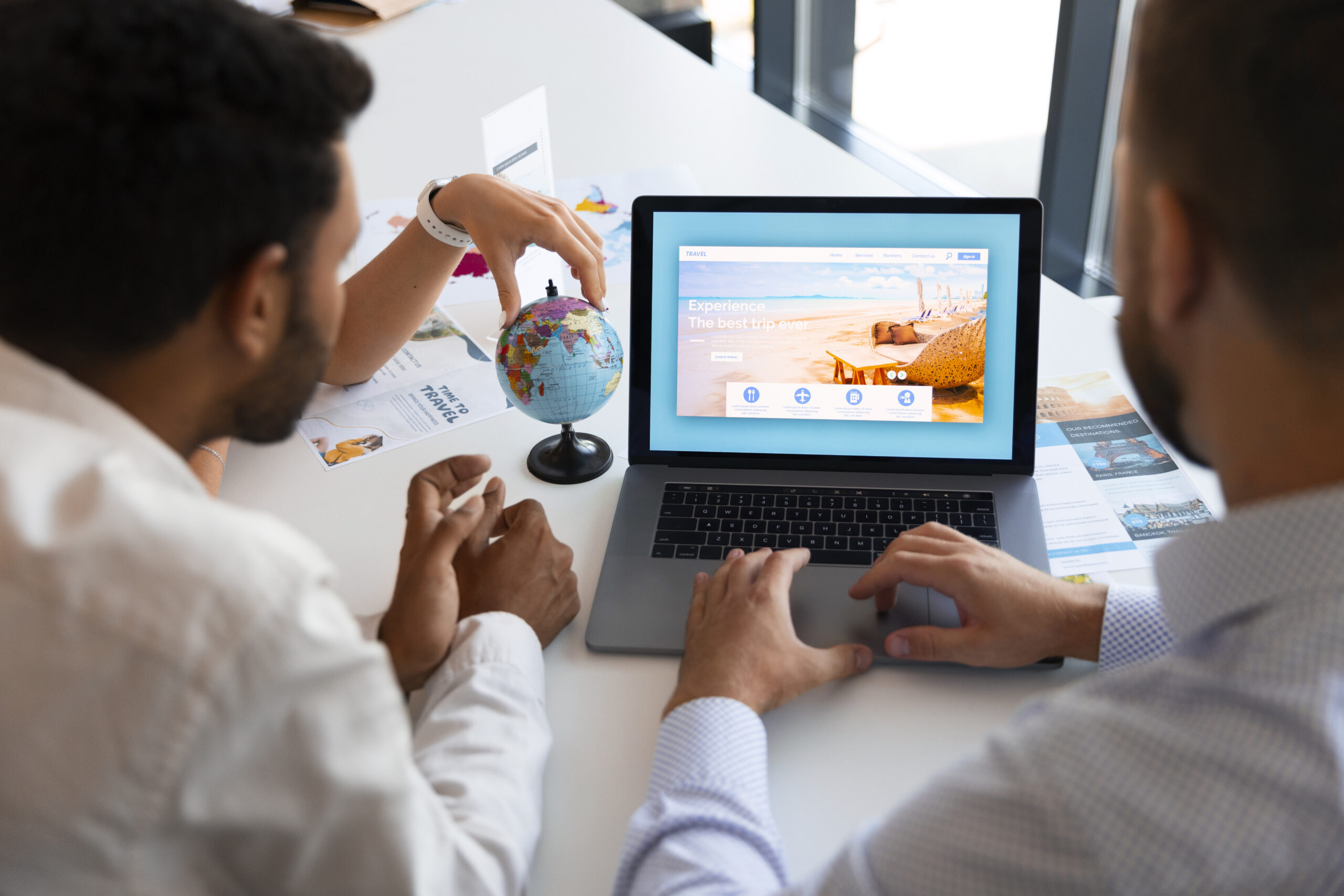 high-angle-man-working-travel-agency web-design-img